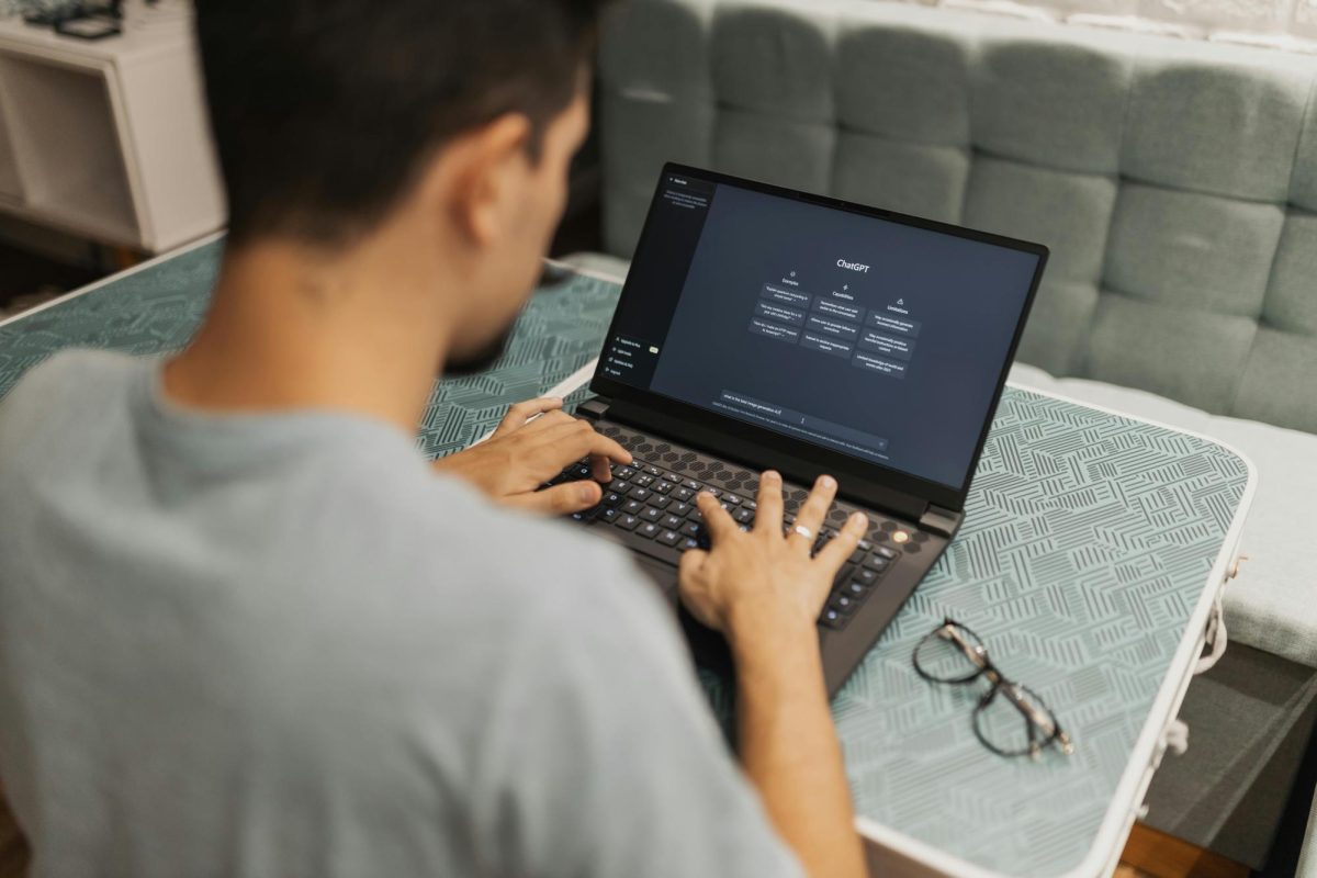 A man typing to ChatGPT on a laptop. (Matheus Bertelli, Pexels)